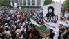 Supporters of the banned Islamist political party Tehrik-e Labaik Pakistan demand the release of their leader and the expulsion of the French ambassador over cartoons depicting the Prophet Muhammad in Karachi on October 24.