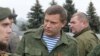 Ukraine -- Alexander Zakharchenko (3-R), Prime Minister of the Donetsk People's Republic surrounded by his guards during a rally, called by pro-Russian rebels, to celebrate the anniversary of the liberation of Donbass from Nazi invaders, Donetsk, 08 Septe