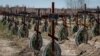 Morminte ale unor persoane neidentificate ucise de soldații ruși în timpul ocupației rusești la Bucea/suburbie a Kievului, la cimitirul orașului 