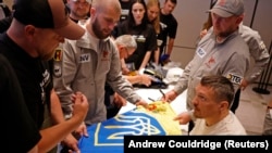 Heavyweight boxing world champion Oleksandr Usyk meets Ukrainian war veterans in London on July 17.<br><br>Usyk will face British boxer Daniel Dubois in a heavyweight rematch on July 19 that will net the Ukrainian a reported $132.8M, one of the largest payouts in boxing history. Usyk’s dominance as a heavyweight against much larger opponents has become a powerful symbol for Ukrainians amid the ongoing Russian invasion.