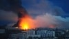 Fire and smoke rise from the site where a Russian missile struck a residential area in Kharkiv, Ukraine on June 7.