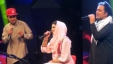 Afghanistan -- Afghan singer Zulala Hashemi (C) performs alongside competitors Sayed Jamal Mubarez (L) and Babak Mohammadi (R) during the television music competition 'Afghan Star' in Kabul, March 9, 2017