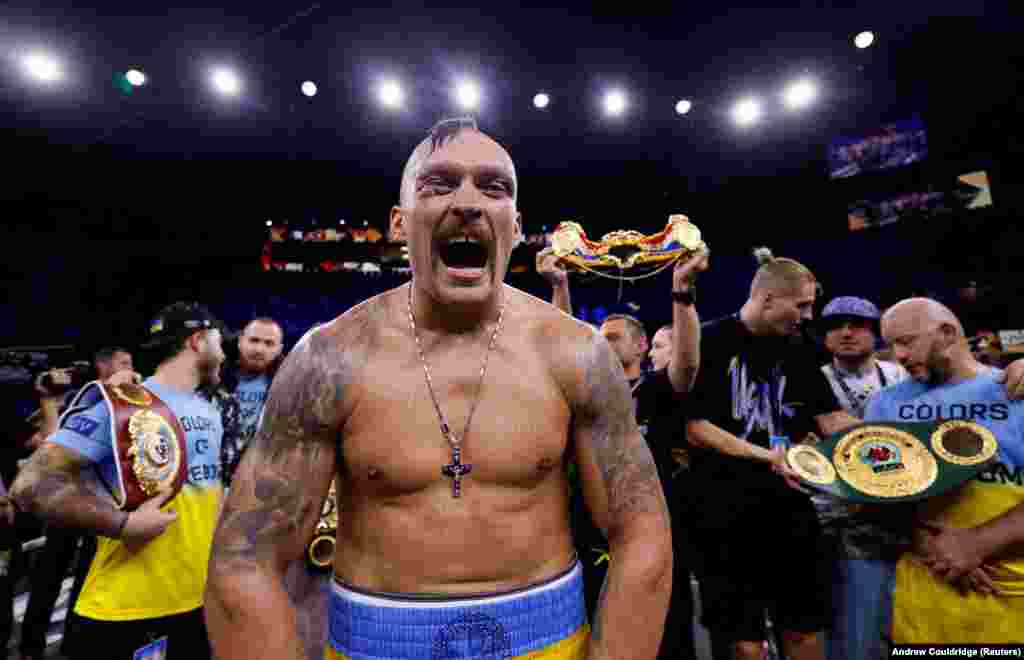 Oleksandr Usyk celebrates winning a rematch against British boxer Anthony Joshua in August 2022.Usyk was convinced by wounded Ukrainian soldiers to leave Ukraine and return to training. “They explained to me that as a soldier I would not be able to do as much for my country as I would as a boxer,” he recalled.