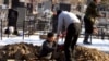 Kyrgyzstan - The digging a grave, South-West Cemetery In Bishkek, 23Jan2012