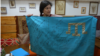 Lerane Haybullayeva qırımtatar bayrağınen
