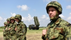 Serbian Army soldiers stand near the Chinese medium-range missile system FK-3, the latest weapon received by the Serbian Army, during a demonstration of Serbian Army's air defence capabilities, "Shield 2022", at the military airport "Colonel-pilot Milenko Pavlovic" in Batajnica, near Belgrade, Serbia, April 30, 2022